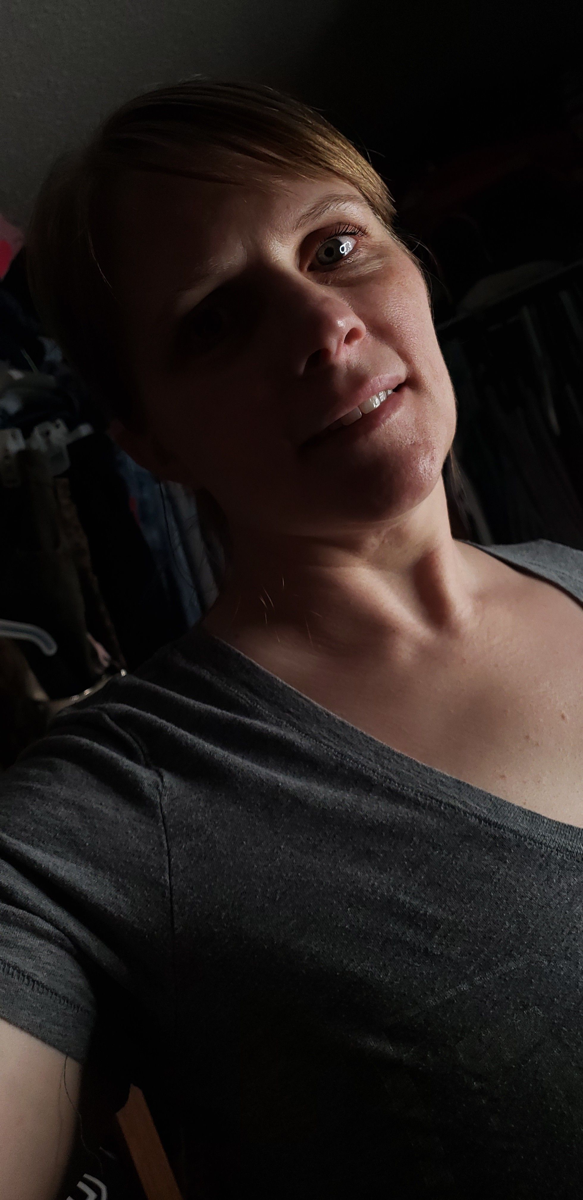 An intimate portrait of Casey in soft shadow