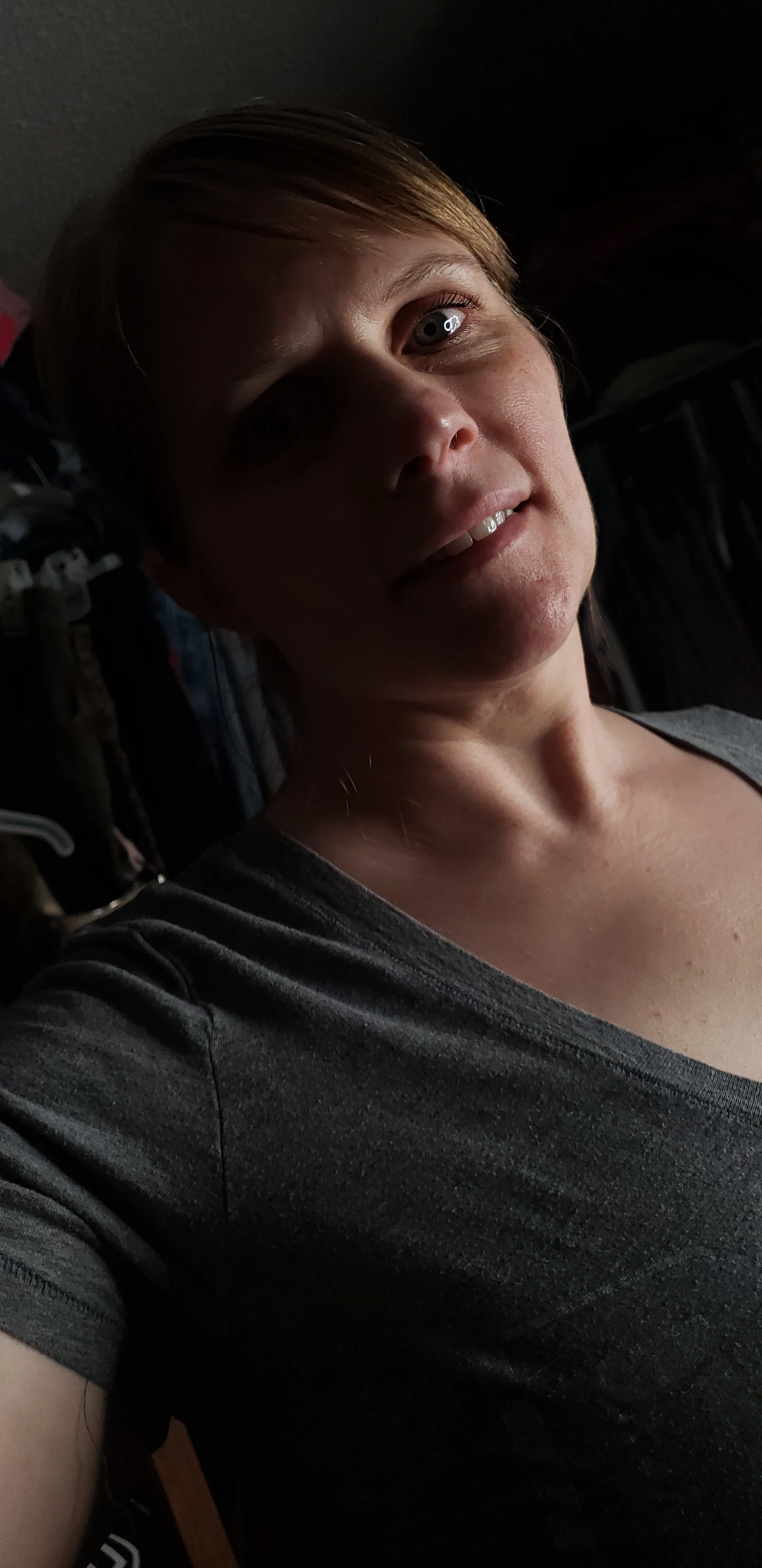 An intimate portrait of Casey in soft shadow