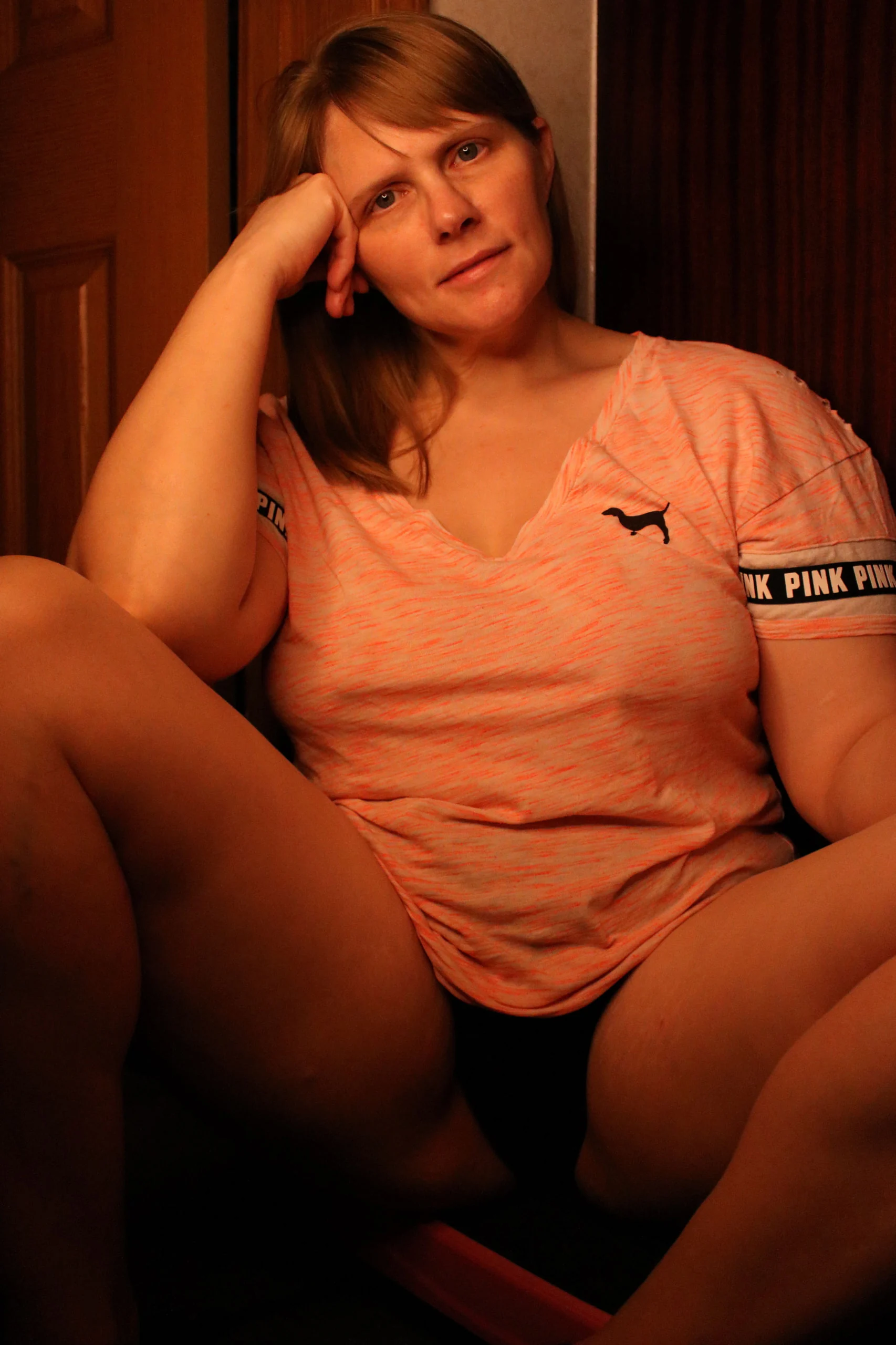 Casey looking toward the camera in warm light